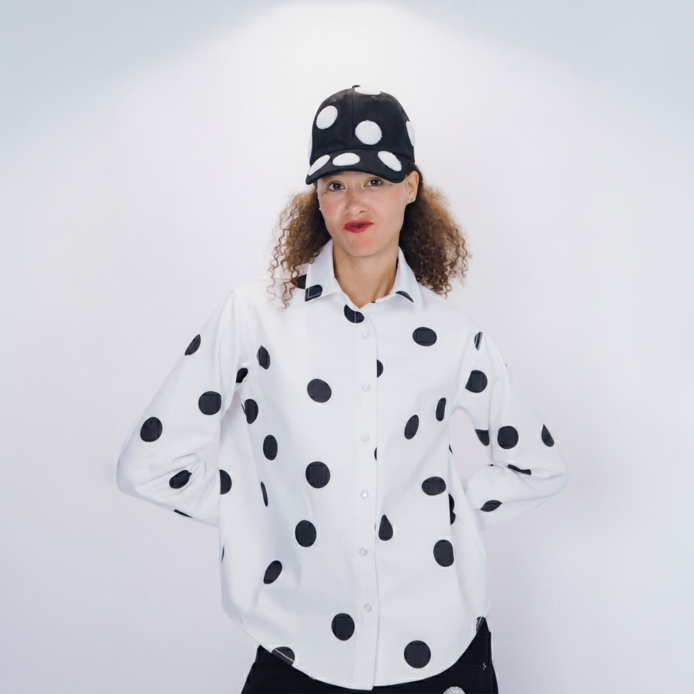 Black structured cap with bold 3D polka dots. Shop premium designer styles online.