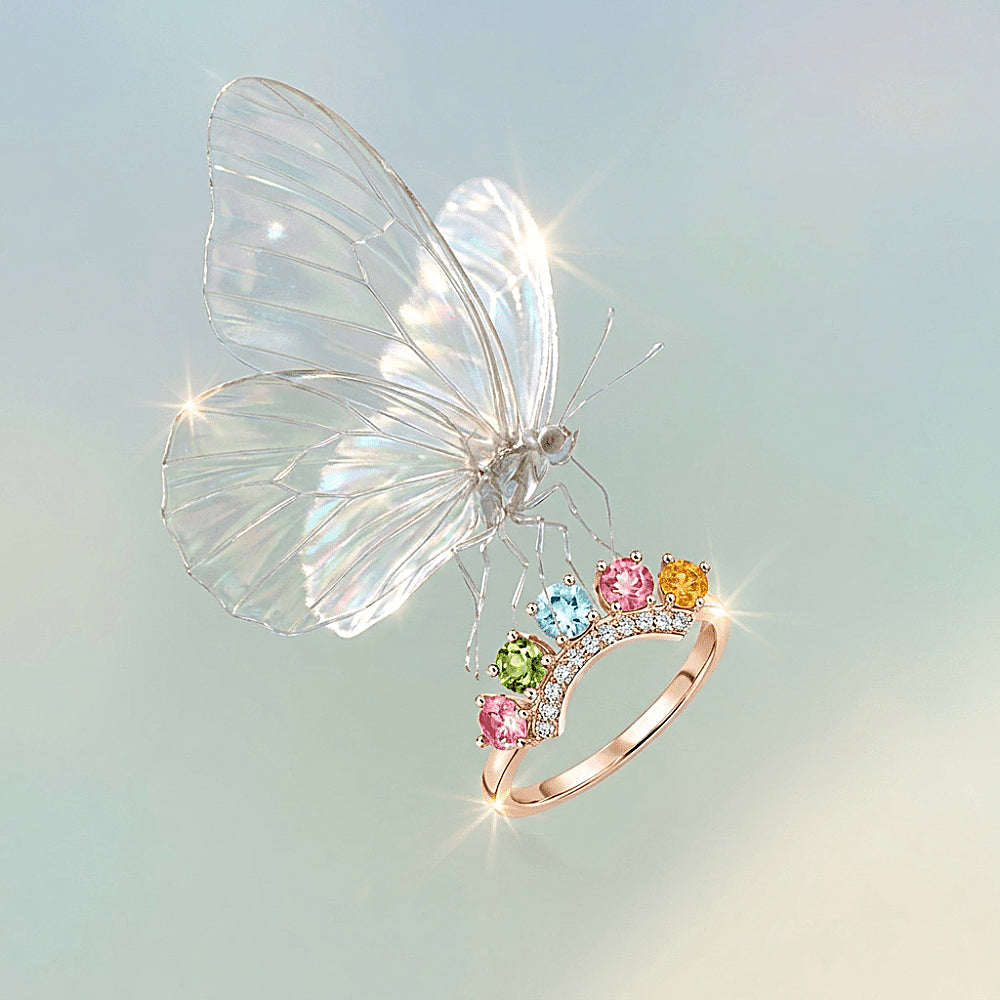 Discover the Rainbow Crown Tourmaline Gemstone Ring at The Luxe Maison, featuring vibrant pink, green, blue, and golden tourmaline gemstones in a crown-inspired design. Crafted in S925 sterling silver with a rose gold finish and sparkling zircon accents, this adjustable ring adds a colorful, elegant touch to everyday style and special occasions.