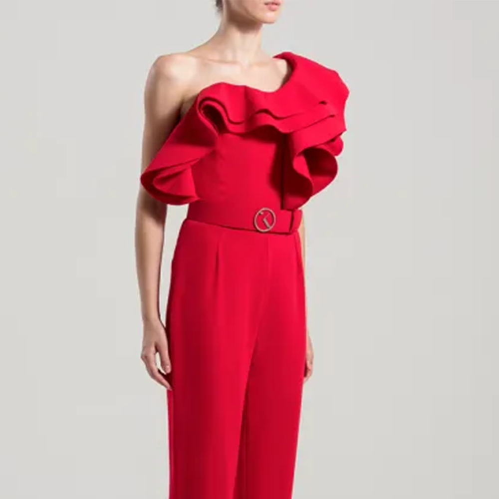 One shoulder crepe jumpsuit with an elaborated multi-layered peplum.