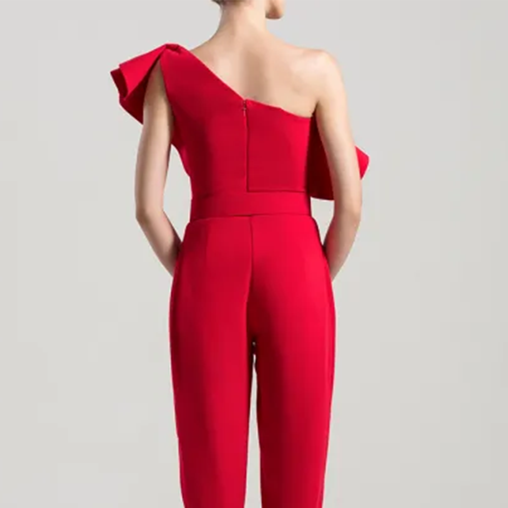 One shoulder crepe jumpsuit with an elaborated multi-layered peplum.