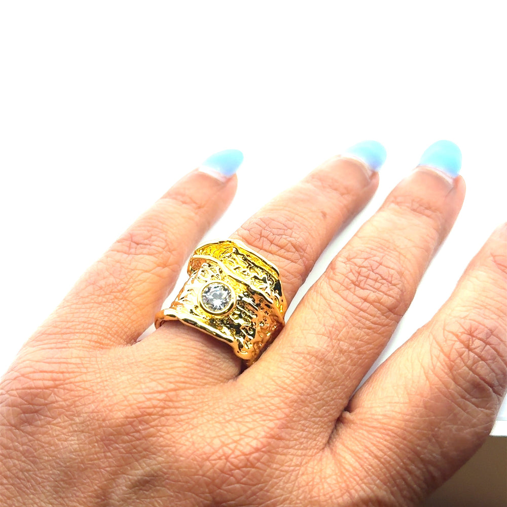 Elegant 22K gold plated chunky ring with sparkling white cubic zirconia and textured detailing. A luxe statement piece for every occasion. Shop premium jewelry online.