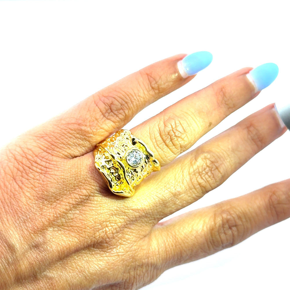 Elegant 22K gold plated chunky ring with sparkling white cubic zirconia and textured detailing. A luxe statement piece for every occasion. Shop premium jewelry online.
