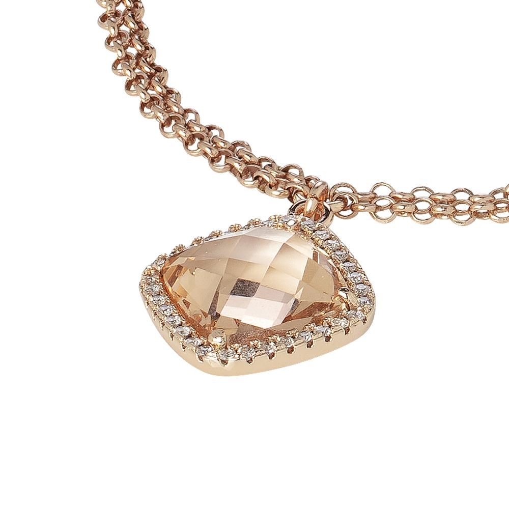 Yellow gold plated double chain bronze bracelet with sparkling cubic zirconia and a peach crystal briolette pendant for a soft modern touch. Shop premium jewelry online.