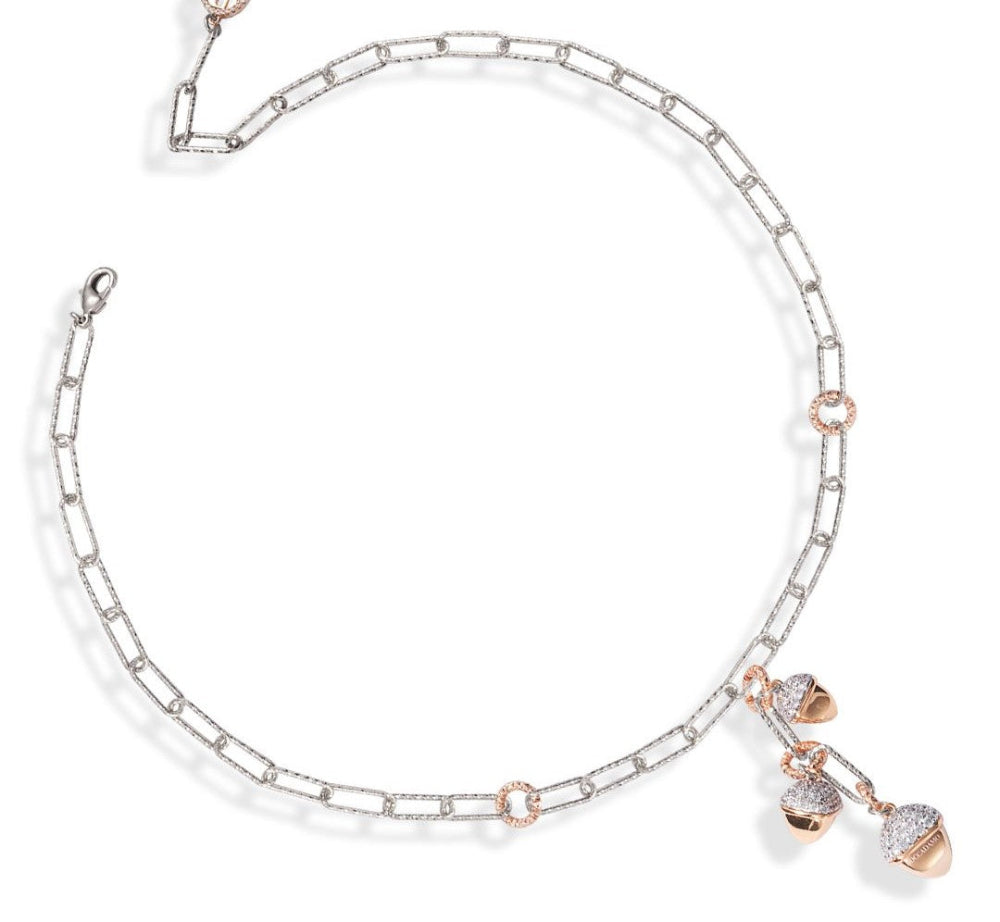 Shop online premium rhodium and rose gold plated necklace with pyramid pendants and sparkling cubic zirconia accents.