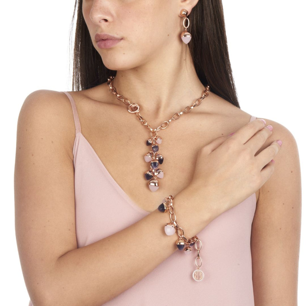 Shop online premium rose gold plated dangle earrings with pink quartz pyramidal crystal on elegant oval counter link detailing.