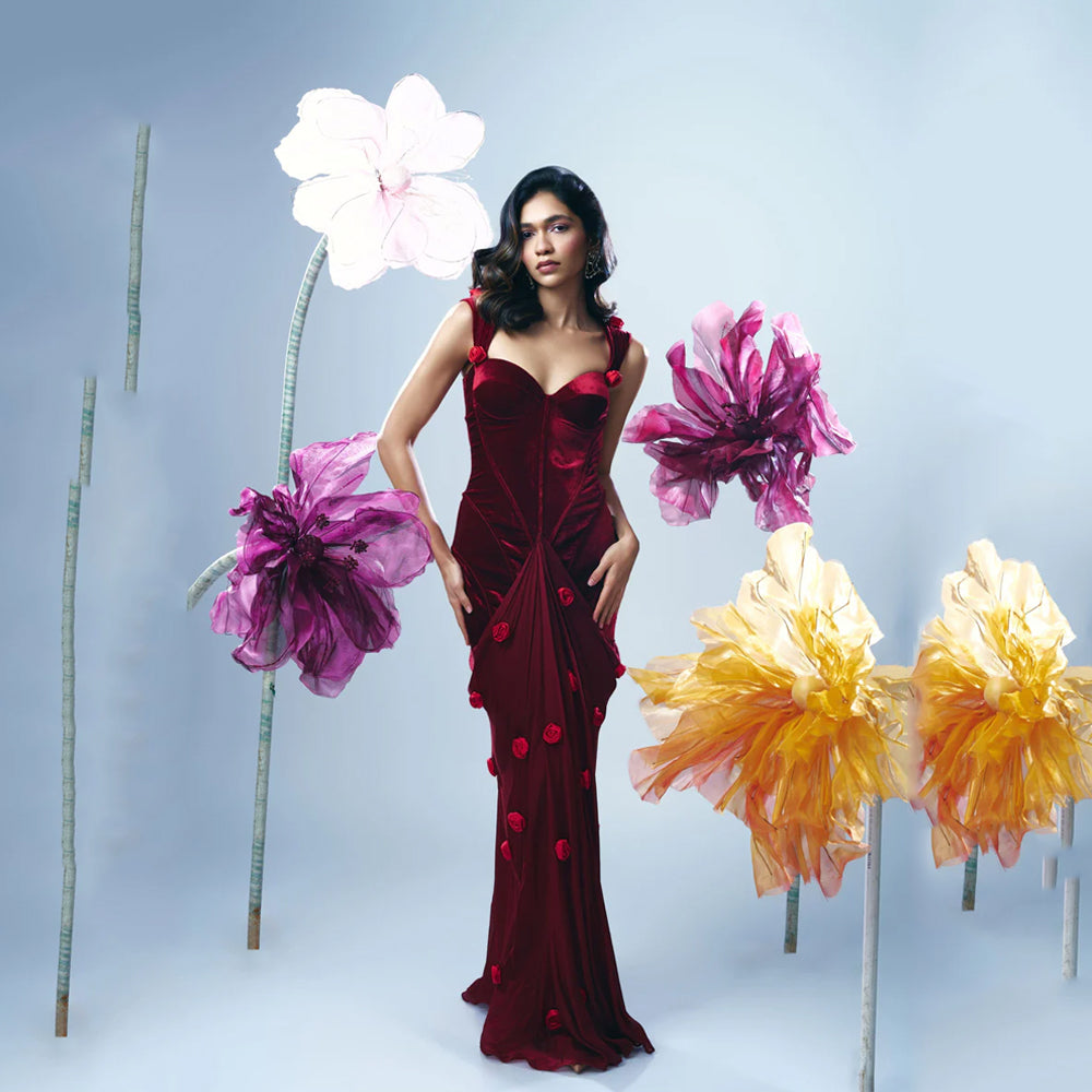 Velvet corset gown with sweetheart neck and rose straps, perfect for events. Shop online from our curated edit of premium fashion.