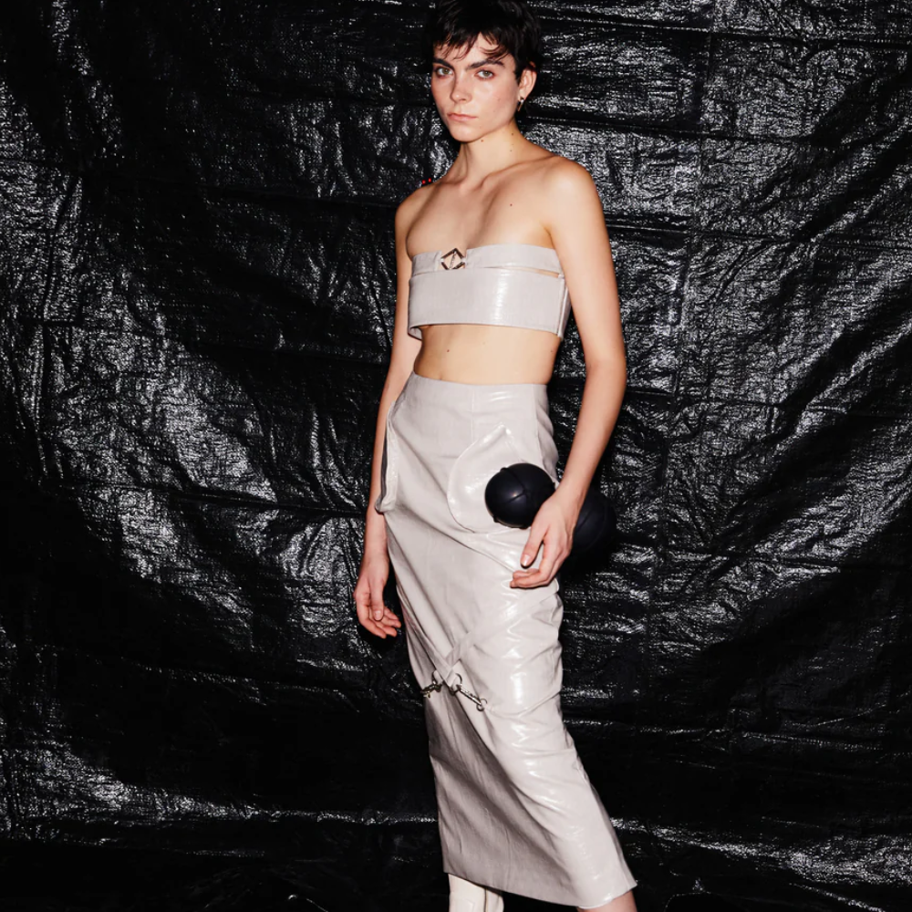 Tube top with side zipper and front hardware. Option to wear it to front or back.