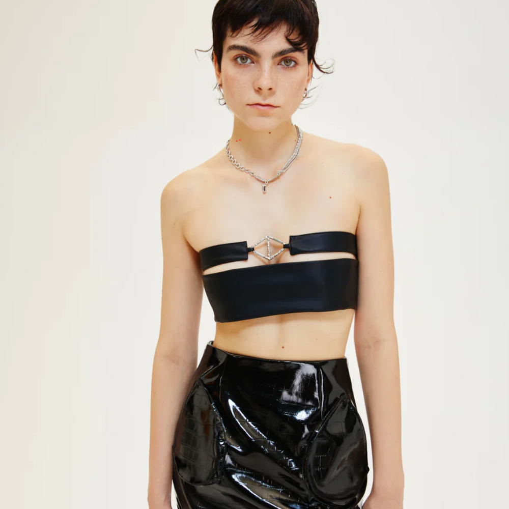 Tube top with side zipper and front hardware. Option to wear it to front or back.