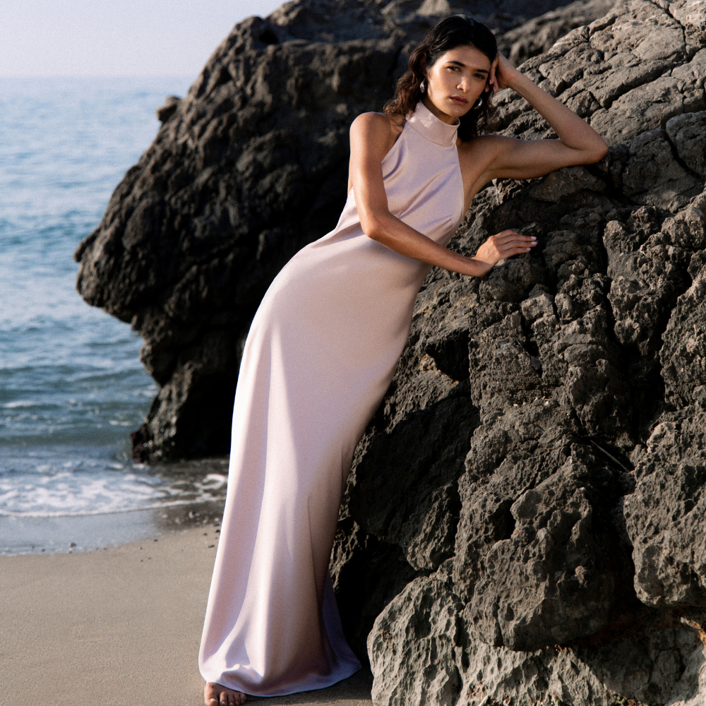 Elegant floor-length dress with a stunning open back for a graceful, timeless look. Shop now at our exclusive clothing website.