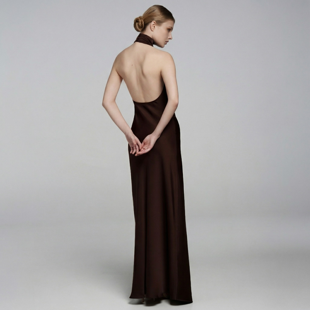 Elegant floor-length dress with a stunning open back for a graceful, timeless look. Shop now at our exclusive clothing website.