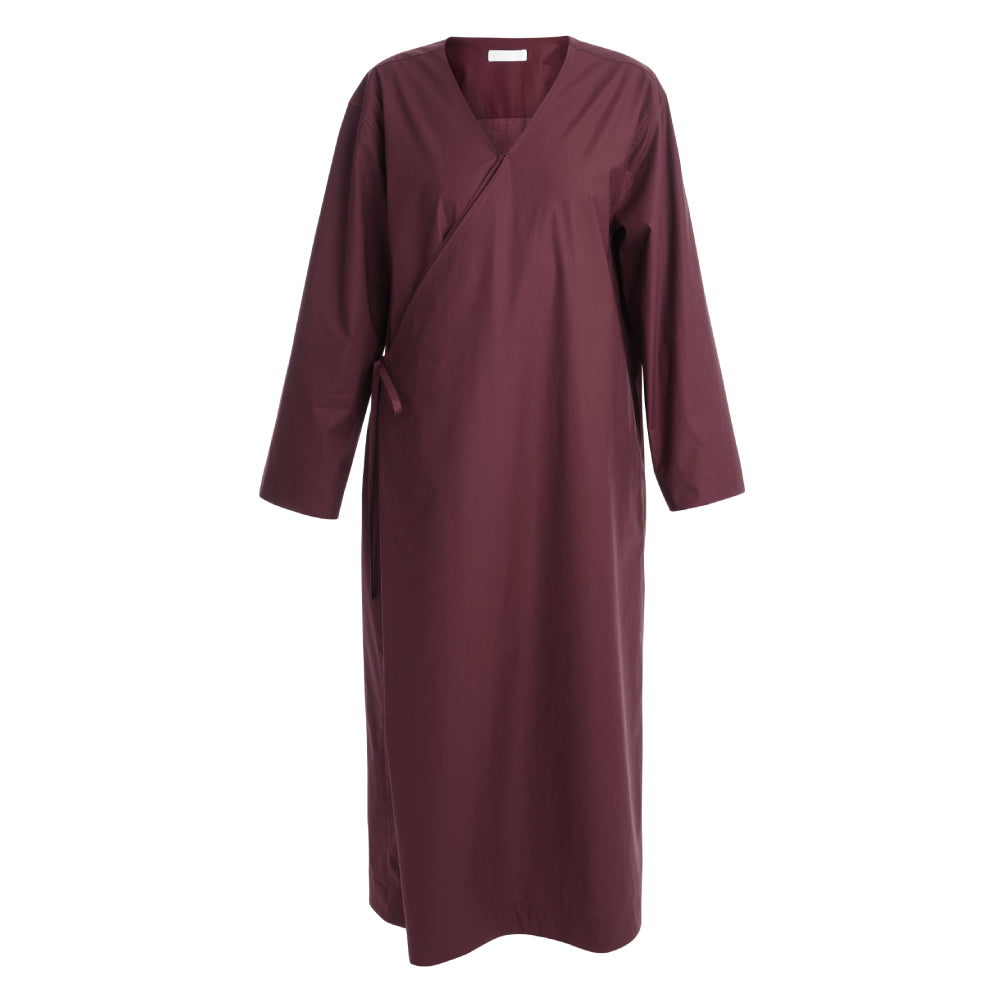 Discover the Sarita Caftan at The Luxe Maison, featuring an ankle-length wrap design, wide sleeves, adjustable side ties, and a V-neckline for effortless elegance.