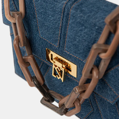 Shoulder bag 45% recycled cotton denim, 40% recycled plastic fabric, 5% gold plated brass, 10% resin chain.