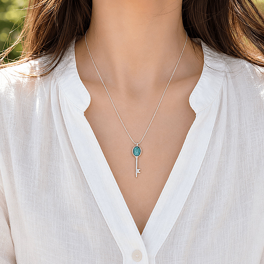 Discover the Shambhala Key Turquoise Necklace at The Luxe Maison, featuring a vibrant turquoise stone, a graceful key pendant, and a sterling silver chain for a timeless, meaningful touch.