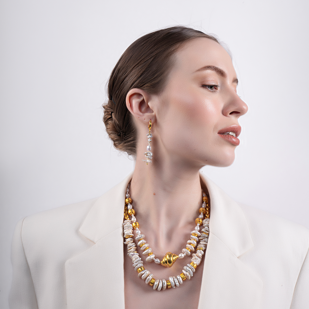 Add a touch of elegance to your style with the Shimmers Necklace, a must-have from online boutiques. Shop Now!