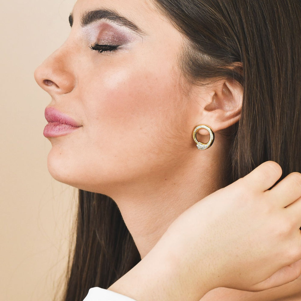 Shop online premium rose gold plated drop earrings with concentric circle design, sky blue stone and sparkling cubic zirconia accents for elegant styling.