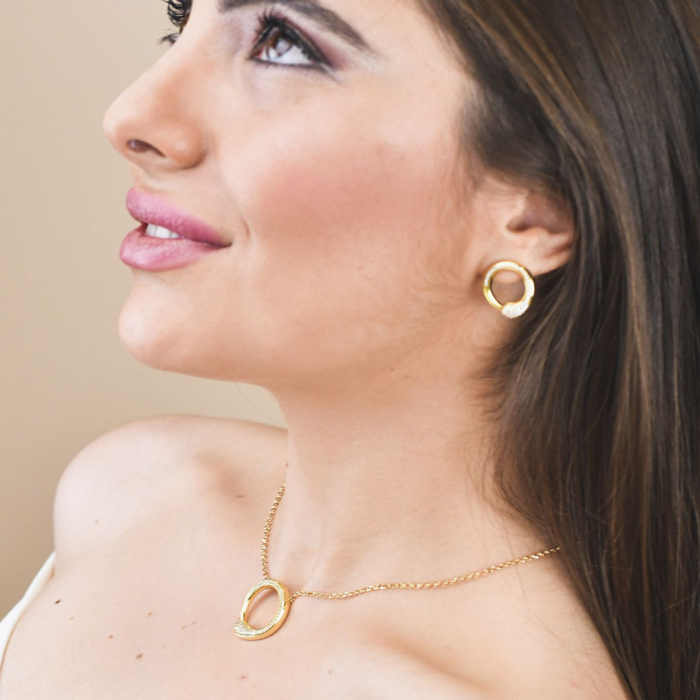 Shop online premium yellow gold pendant necklace with sparkling pave cubic zirconia circle design.