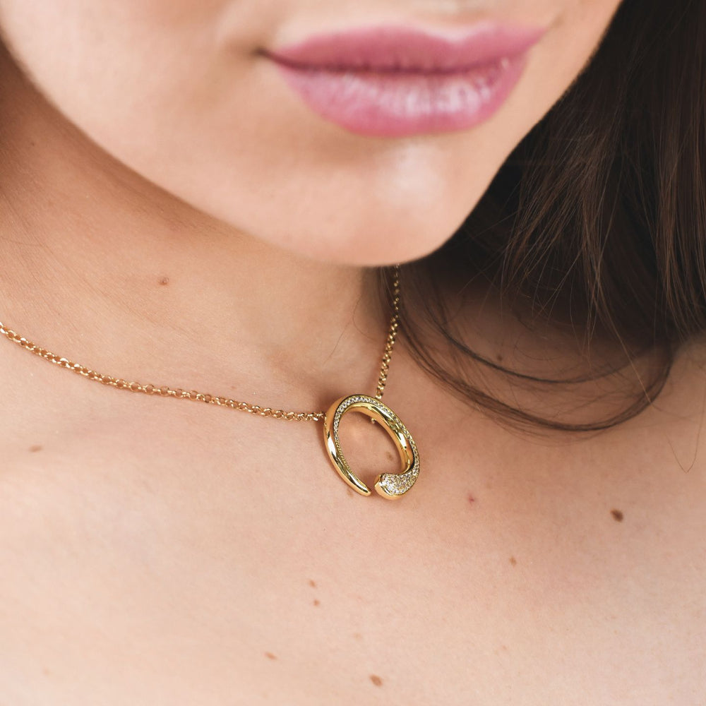 Shop online premium yellow gold pendant necklace with sparkling pave cubic zirconia circle design.