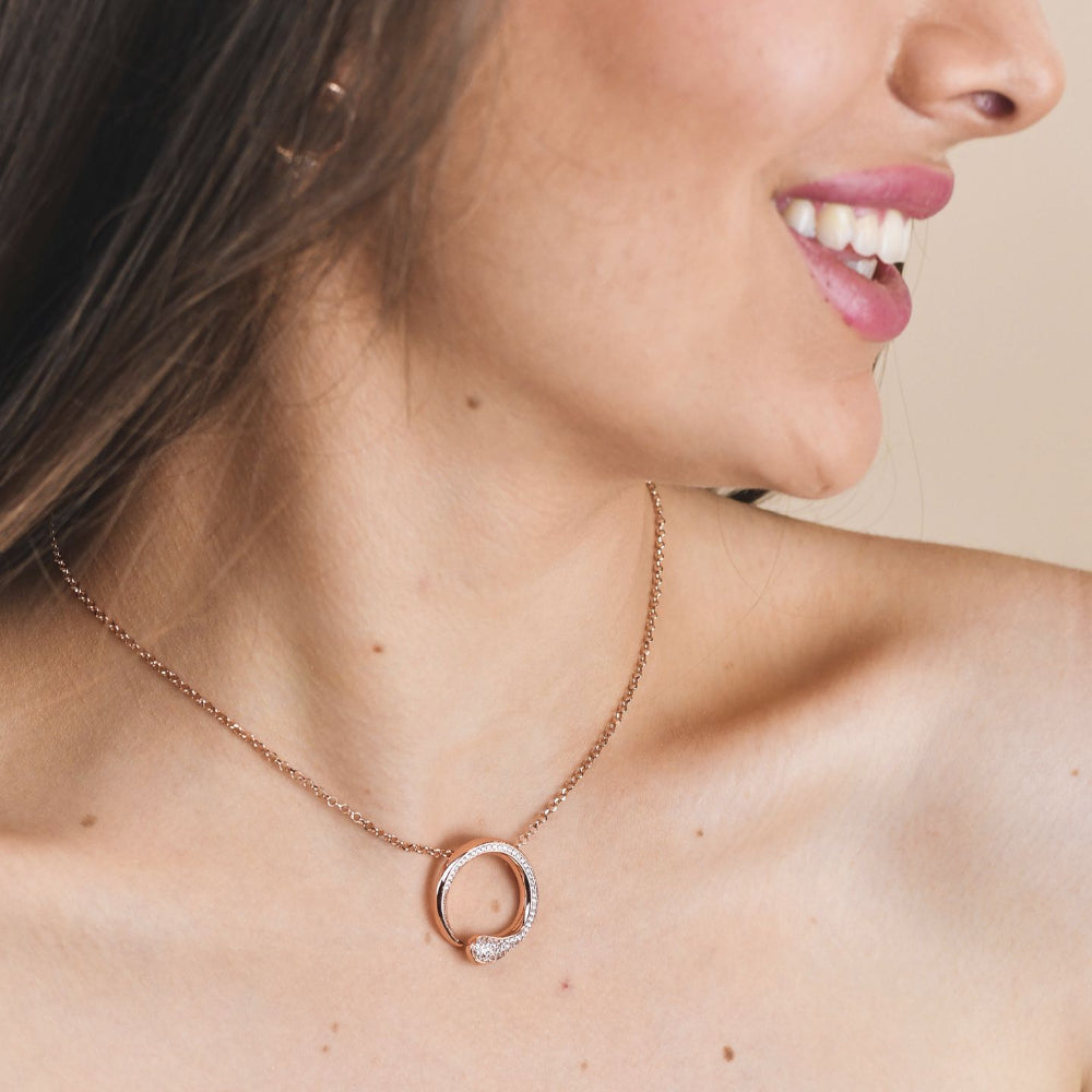 Shop online premium rose gold pendant necklace with sparkling pave cubic zirconia circle motif.