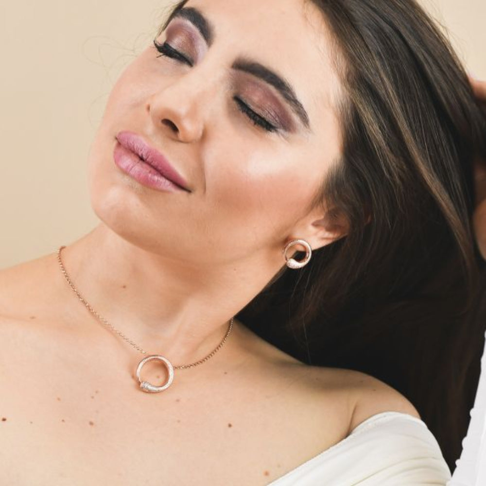 Shop online premium rose gold pendant necklace with sparkling pave cubic zirconia circle motif.