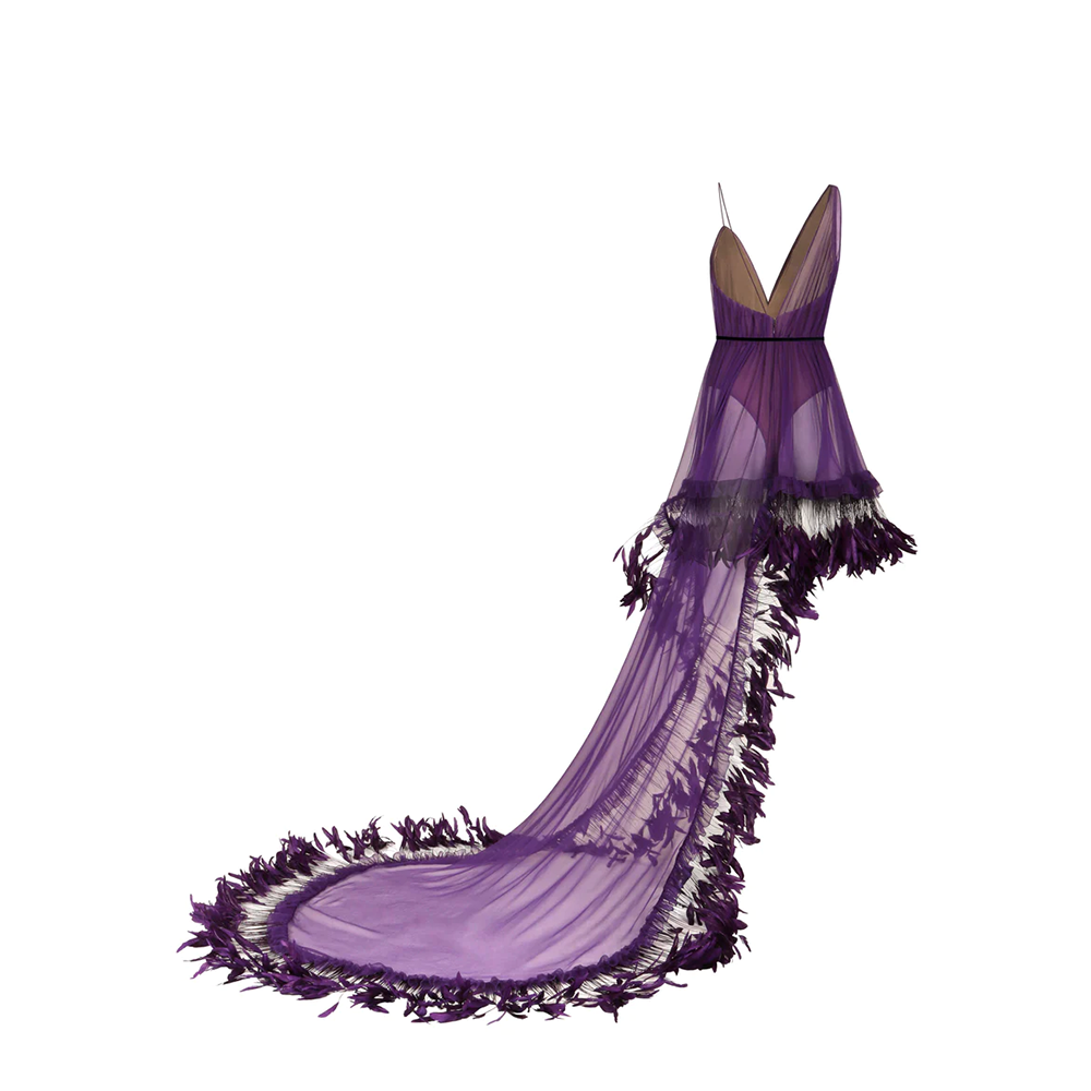 A purple silk chiffon mini-dress with an integrated scarf train and ruffled coq plumes.