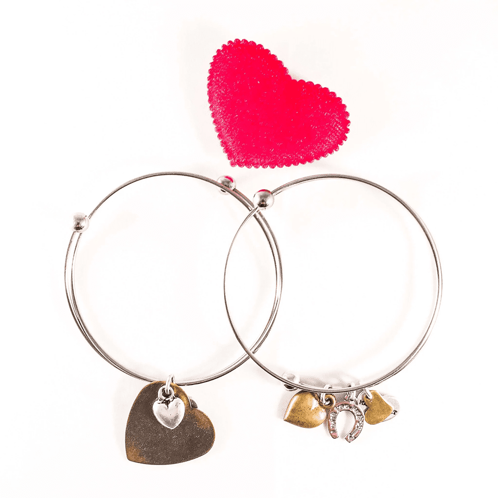 Silver Plated Bangle With Bronze Heart Charms made of high quality Italian materials with an affordable price.
