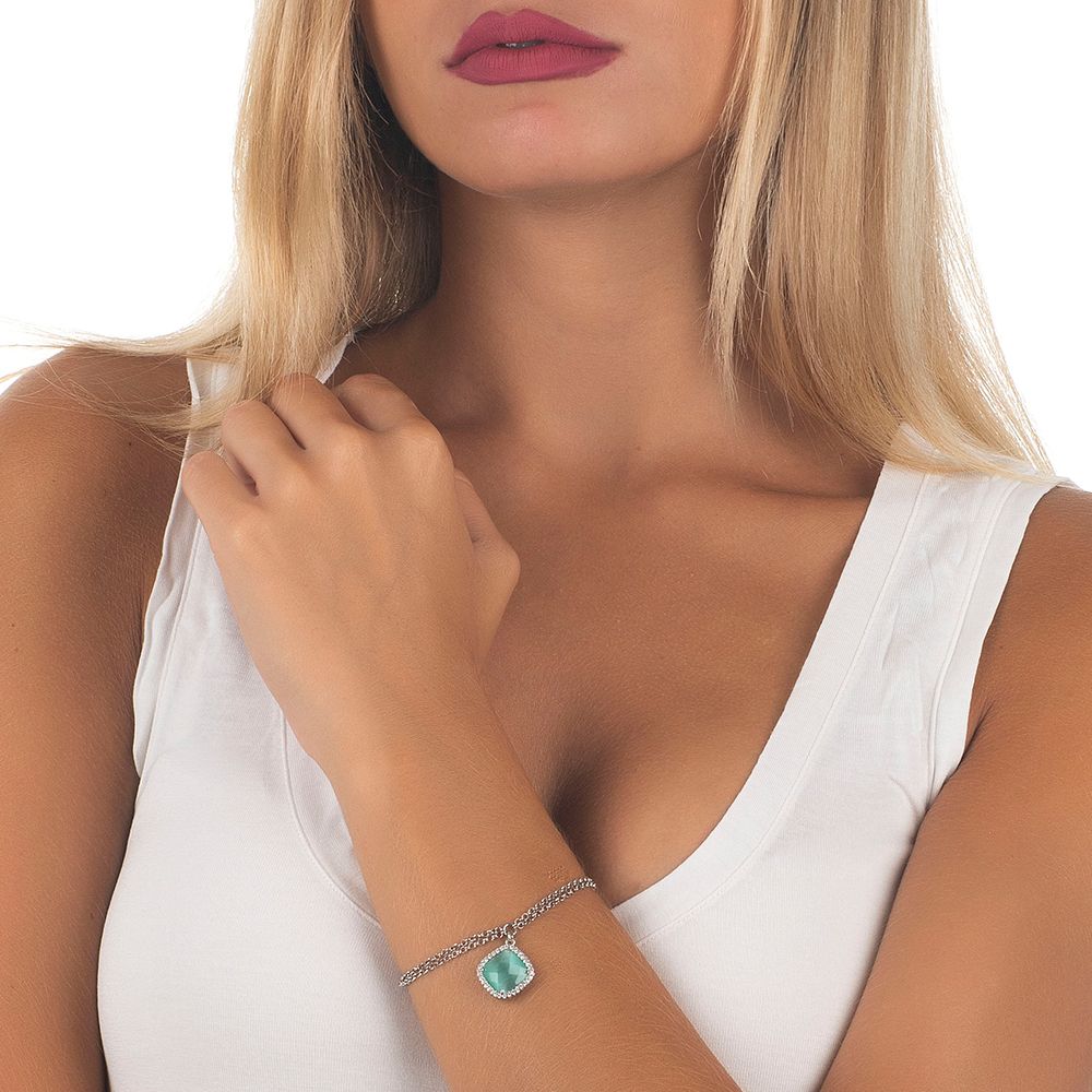 Rhodium-plated double chain bronze bracelet with sparkling cubic zirconia and a green mint crystal briolette pendant for a fresh contemporary look. Shop premium jewelry online.