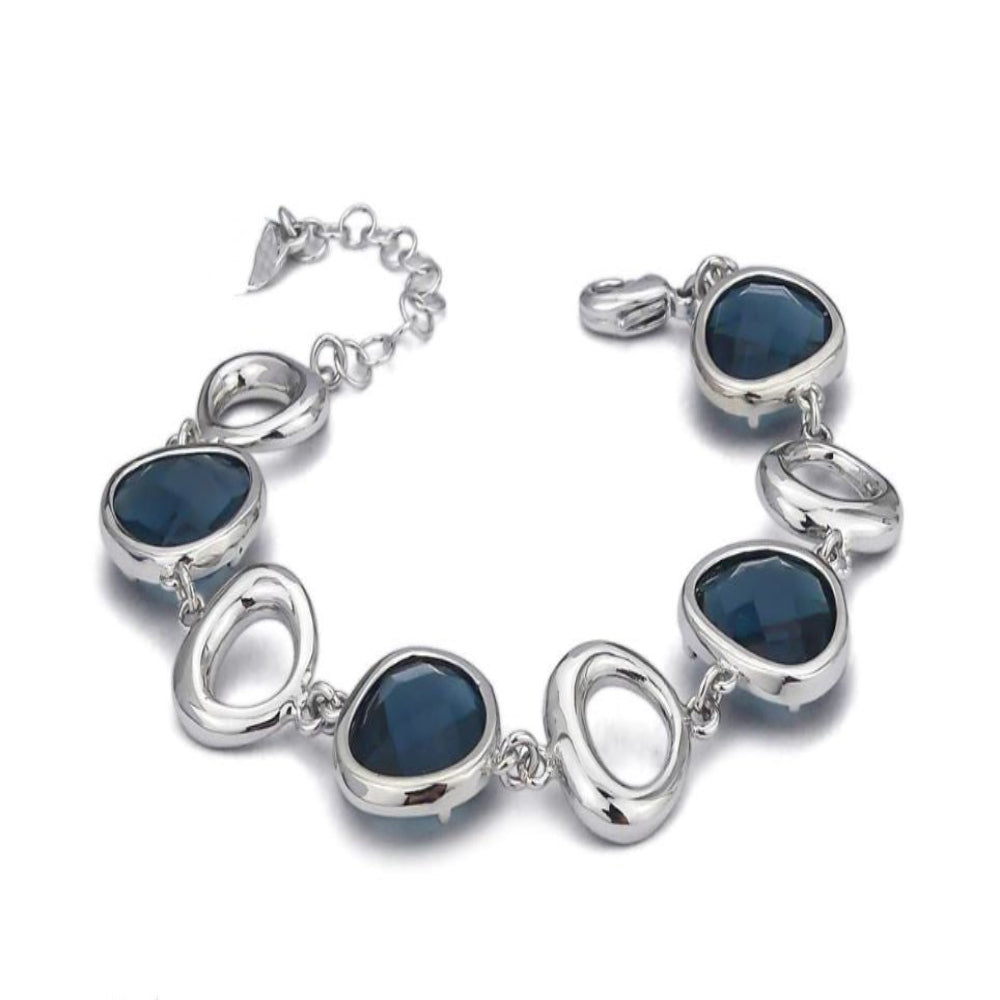 Elegant rhodium plated bronze bracelet with irregular modular elements and montana blue briolette-cut crystal accents. Shop premium jewelry online.