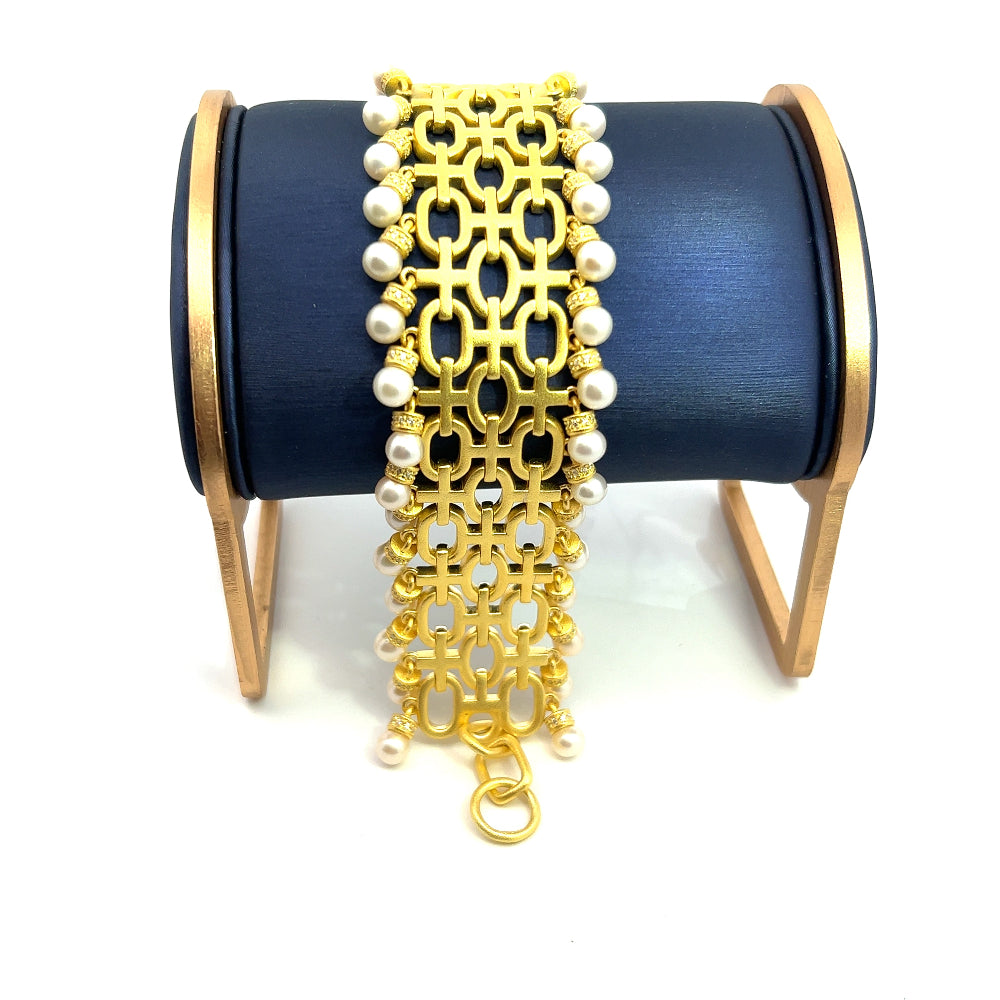 Sterling silver 18k gold-dipped bracelet with freshwater pearls and sparkling cubic zirconia accents for a refined timeless look. Shop premium jewelry online.
