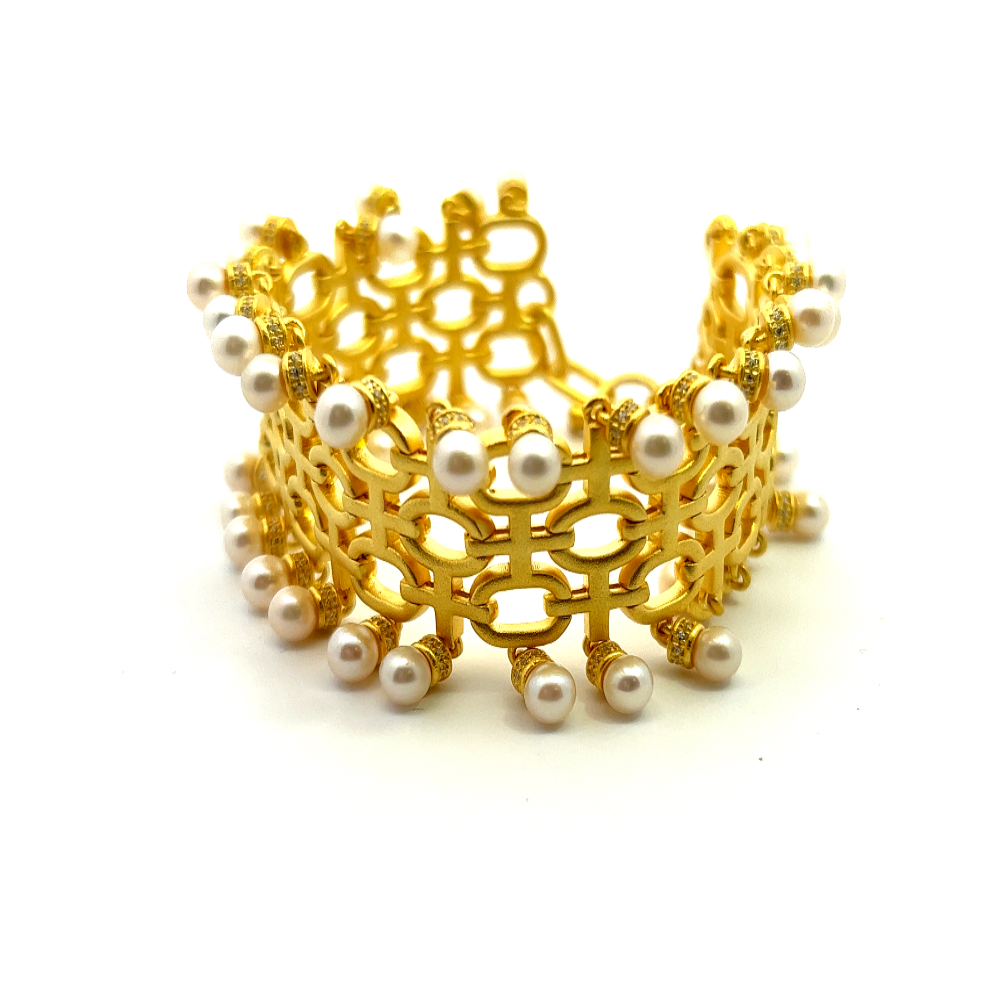 Sterling silver 18k gold-dipped bracelet with freshwater pearls and sparkling cubic zirconia accents for a refined timeless look. Shop premium jewelry online.