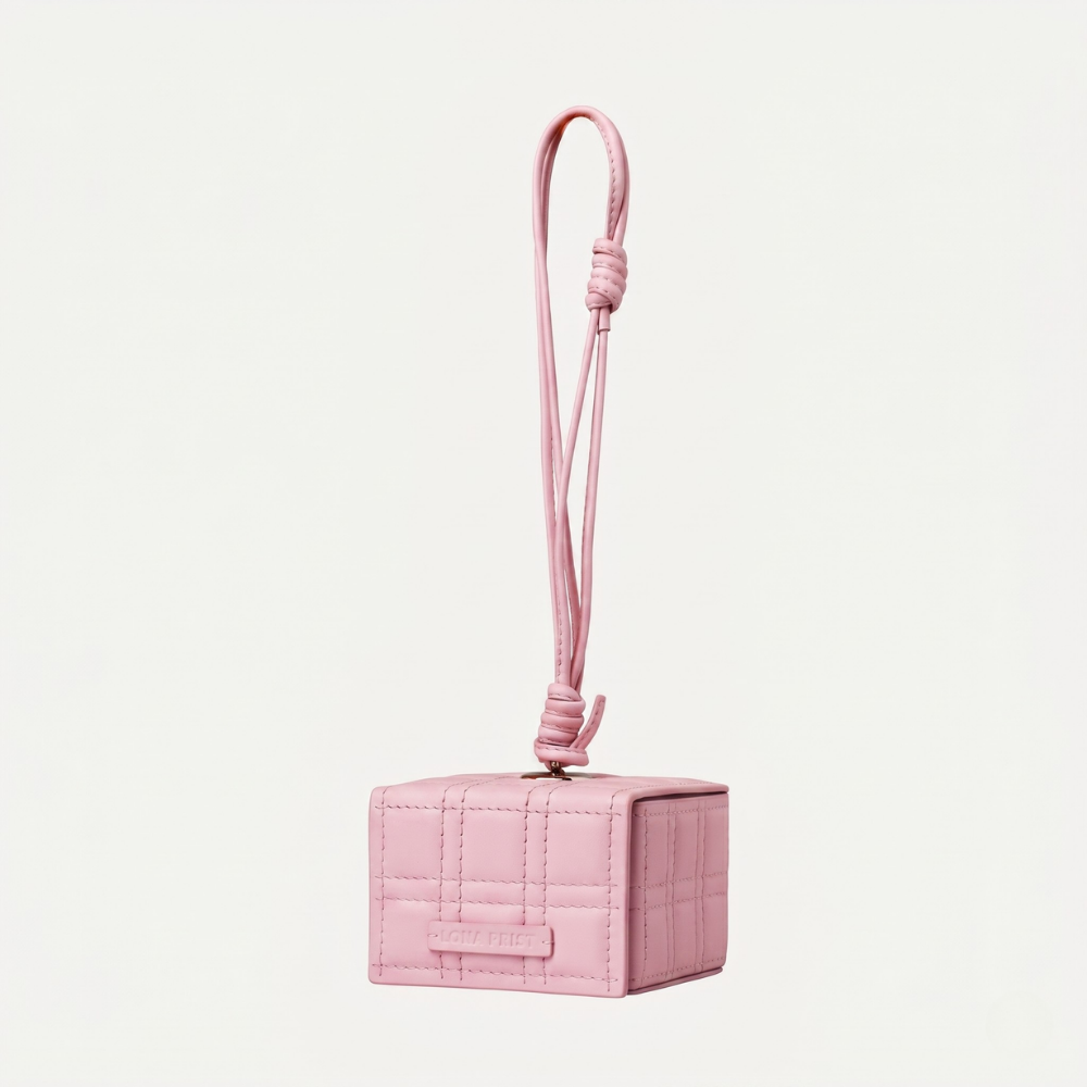 Genuine leather handbag with magnetic closure and silver hardware. Shop online from our curated edit of premium fashion.