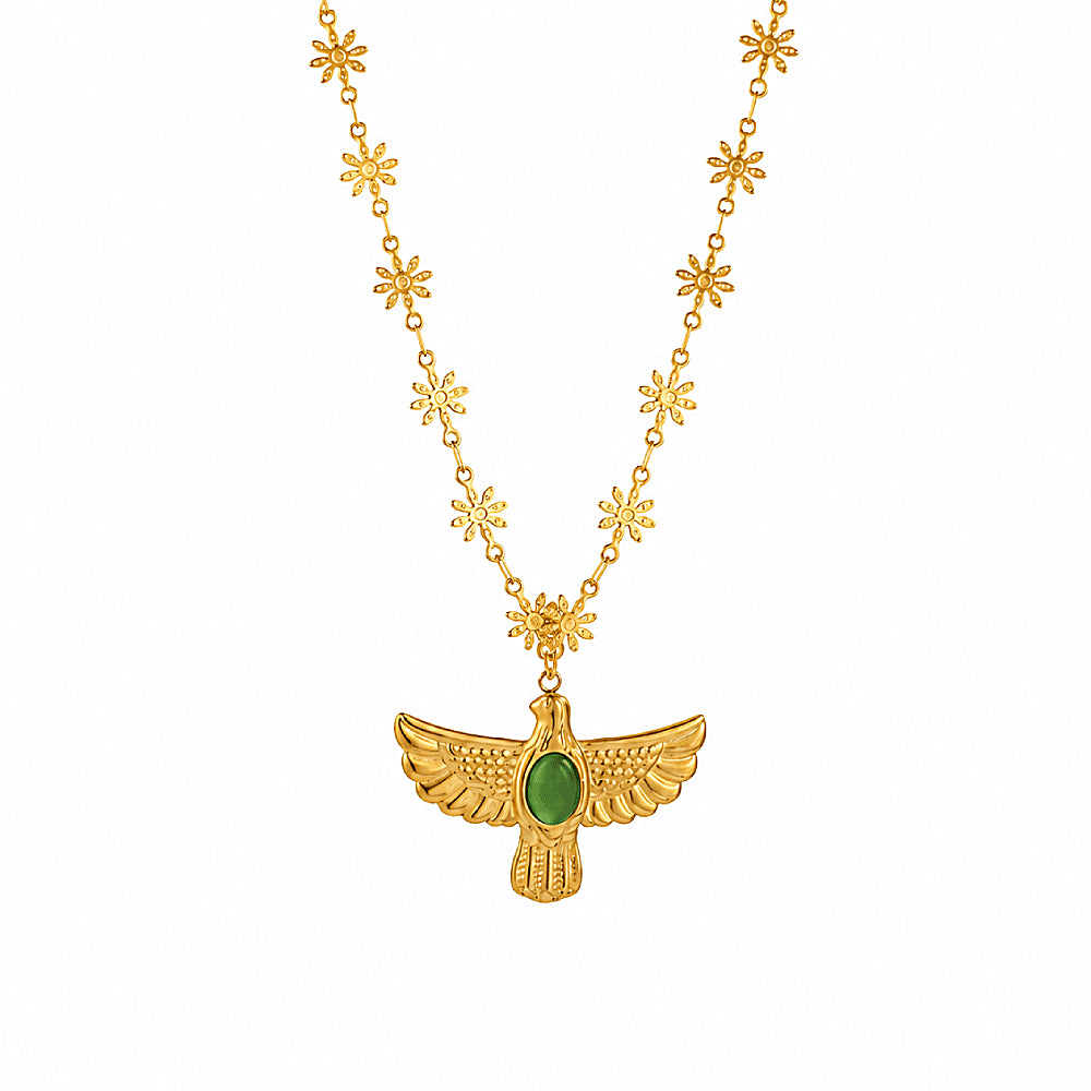 Discover the Soar & Shine Thunderbird Necklace at The Luxe Maison, featuring a radiant gold-tone Thunderbird pendant, a luminous green cat's eye stone, and a delicate sunburst chain for a bold, meaningful touch.