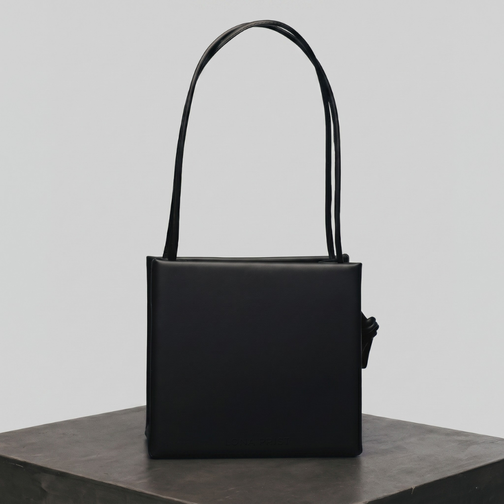 Premium leather bag with versatile handles and flap closure, pre order. Shop online from our curated edit of premium fashion.