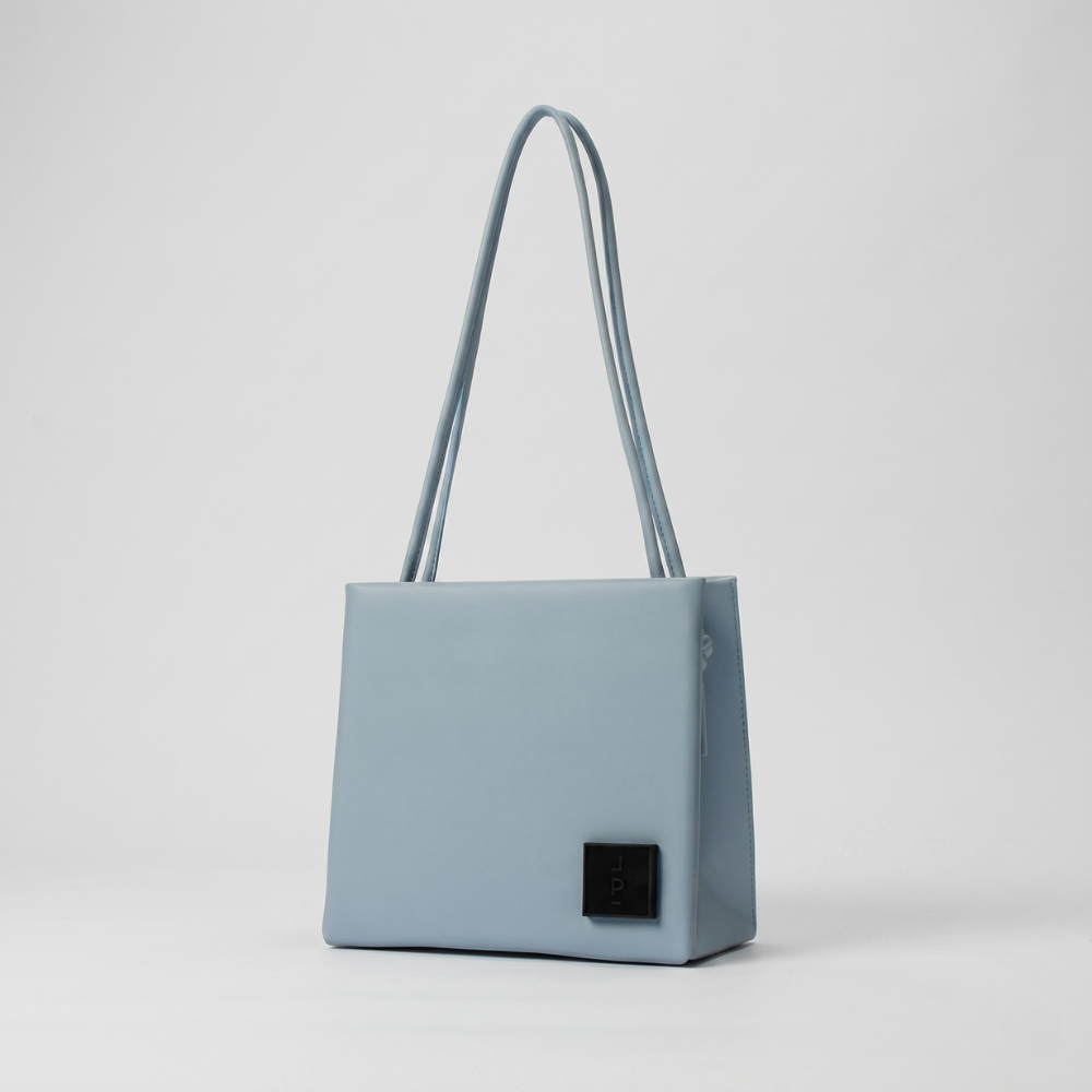 Genuine leather bag with flap closure, silver hardware and back pocket. Shop online from our curated edit of premium fashion.