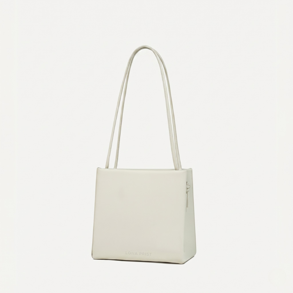 Premium leather bag with versatile handles and flap closure, pre order. Shop online from our curated edit of premium fashion.