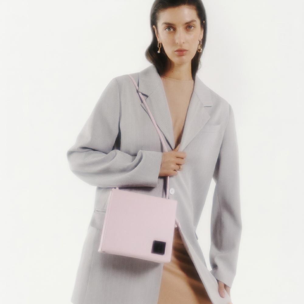 Genuine leather bag with silver hardware and flap closure, perfect for everyday use. Shop online from our curated edit of premium fashion.