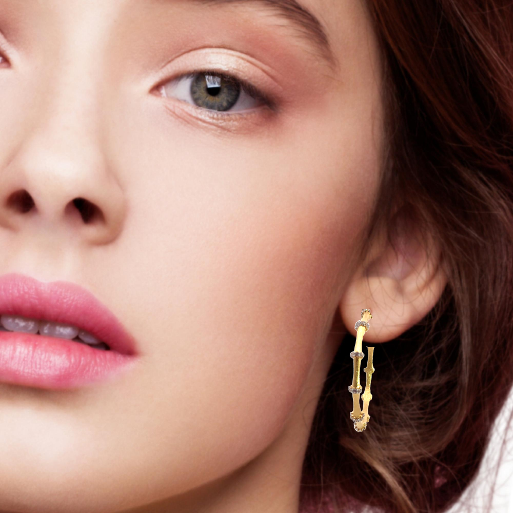 Shop sterling silver bamboo hoop earrings featuring sparkling cubic zirconia. Timeless, elegant hoops crafted for everyday wear and special occasions.