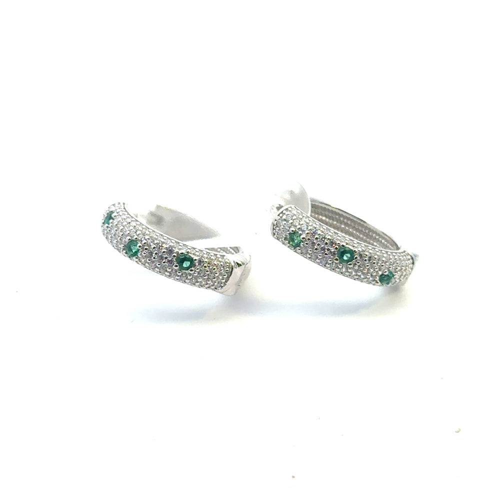 Shop sterling silver emerald huggie earrings featuring lab-created emeralds, sparkling cubic zirconia, and an elegant oval pavé design.