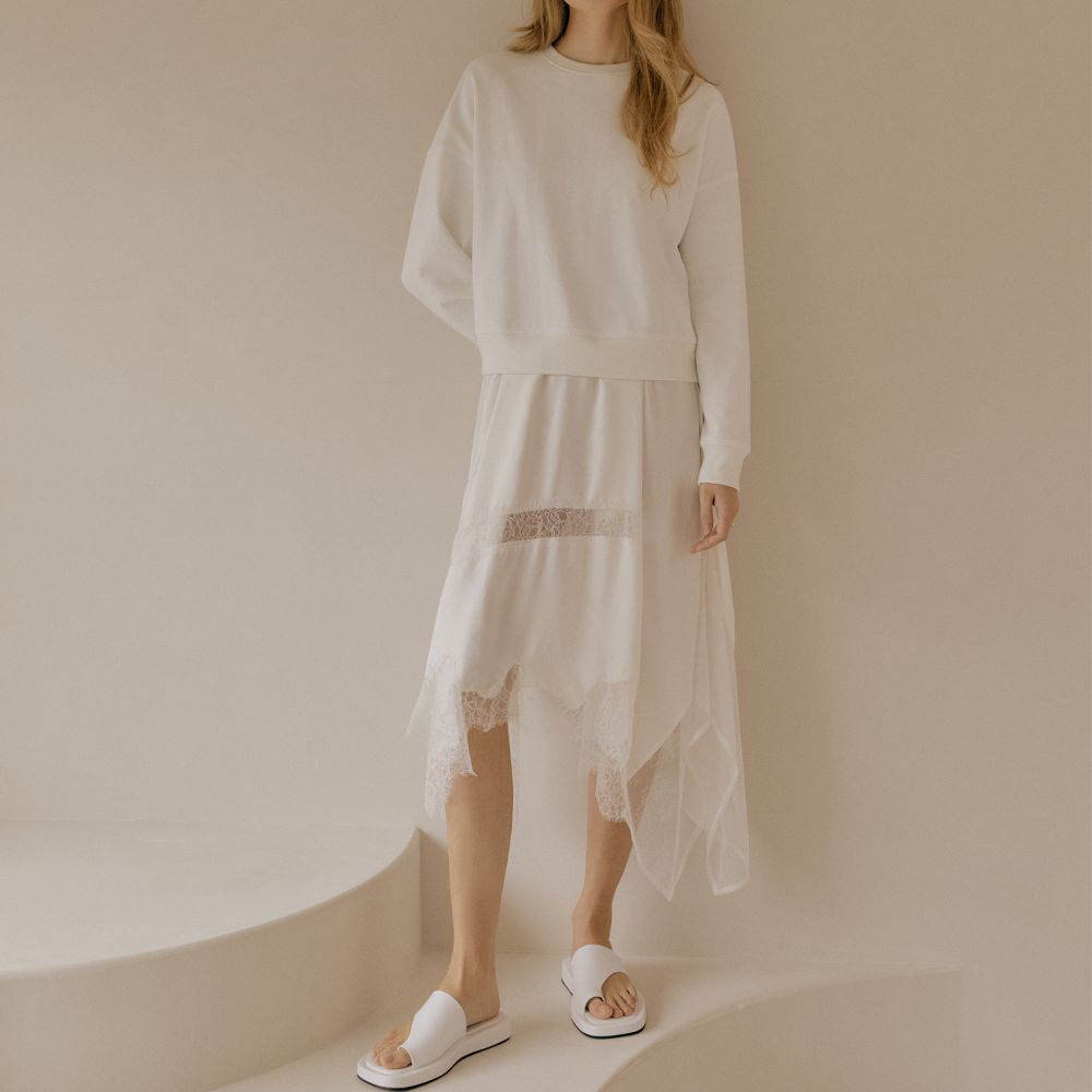 Raw-edged, Round neckline One side handkerchief-hem with patch pocket Adjustable tie belt at waist Relaxed silhouette.