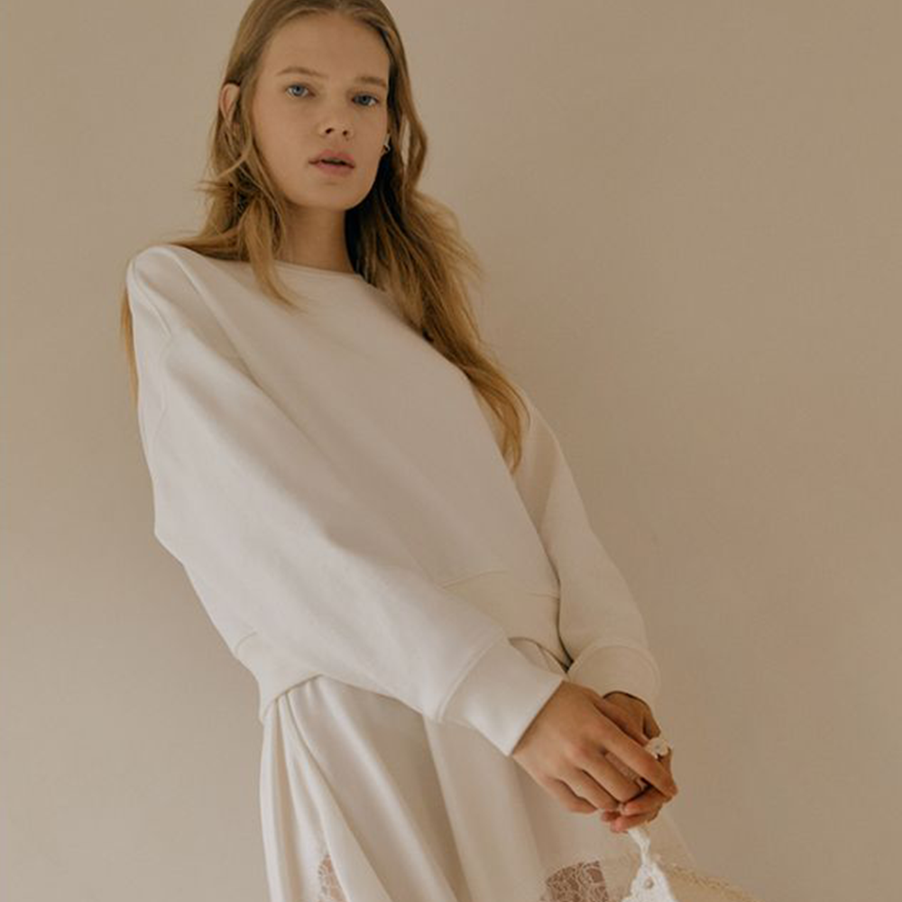 Raw-edged, Round neckline One side handkerchief-hem with patch pocket Adjustable tie belt at waist Relaxed silhouette.