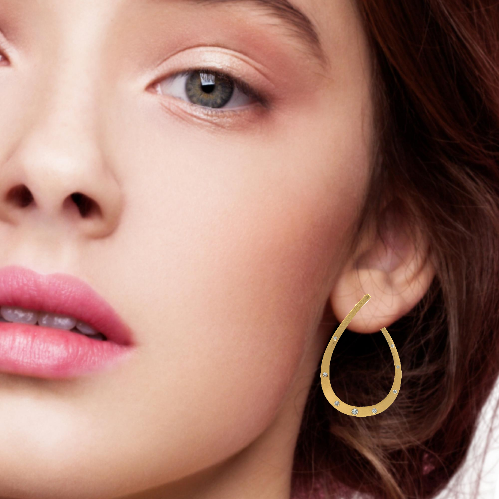 Shop online premium 18K gold-dipped teardrop hoop earrings with sparkling CZ stones.