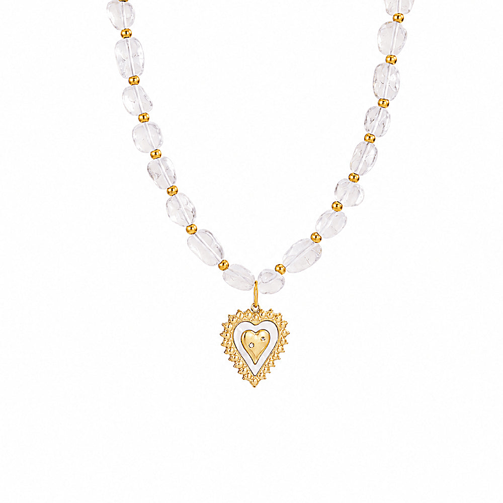 Discover the Telos Heart Clear Quartz Beaded Necklace at The Luxe Maison, featuring luminous quartz beads and a golden heart pendant inspired by love and light.