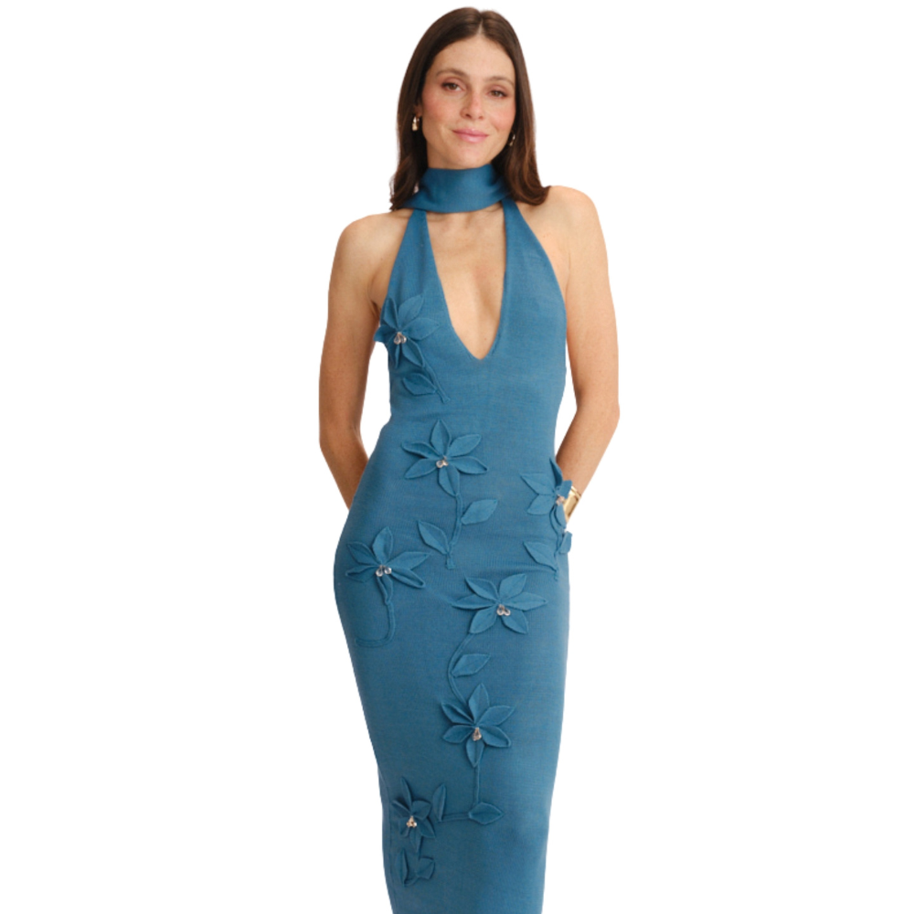 Shop the Uchi Maxi Dress at TLM, featuring a deep V-neck, halter silhouette and 3D floral appliqués. Explore luxury fashion on The Luxe Maison website.