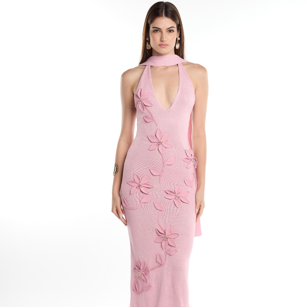 Shop the Uchi Maxi Dress at TLM, featuring a deep V-neck, halter silhouette and 3D floral appliqués. Explore luxury fashion on The Luxe Maison website.