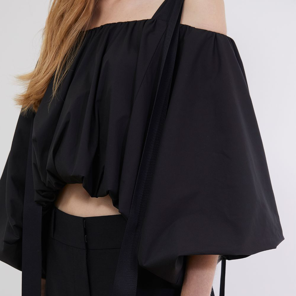 Raw-edged, Round neckline One side handkerchief-hem with patch pocket Adjustable tie belt at waist Relaxed silhouette.