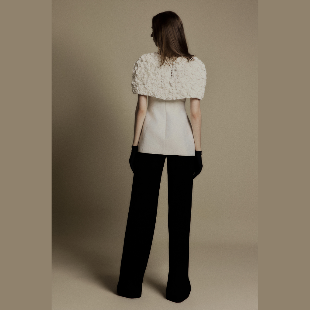 Discover chic designer women's clothing featuring the sophisticated White Bloom 3D Floral Cape. Shop Now!