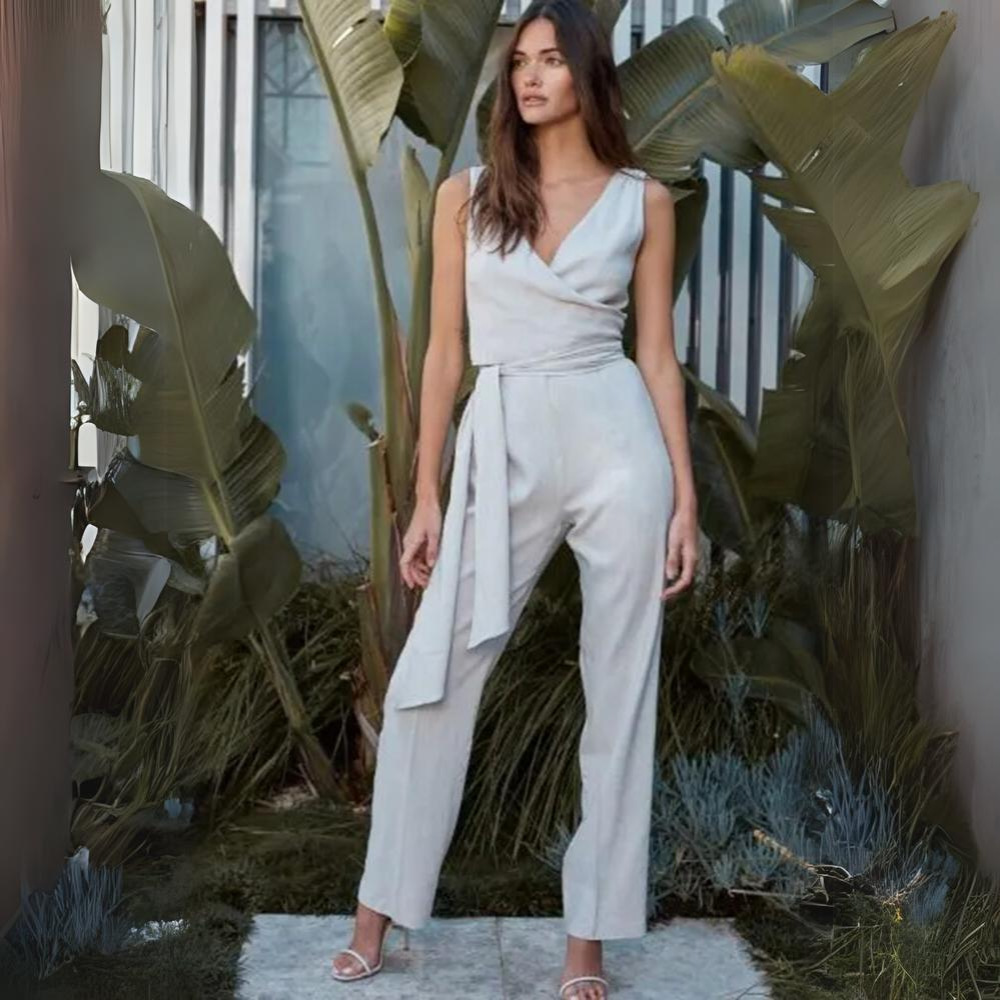 Our wrap Jumpsuit is made in lightweight soft linen and allows for versatile styling options.
