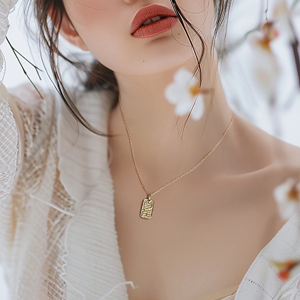 Discover the Zizai Seal Necklace at The Luxe Maison, featuring a traditional Chinese seal-inspired pendant symbolizing freedom, inner peace, and effortless balance for a meaningful, timeless look.