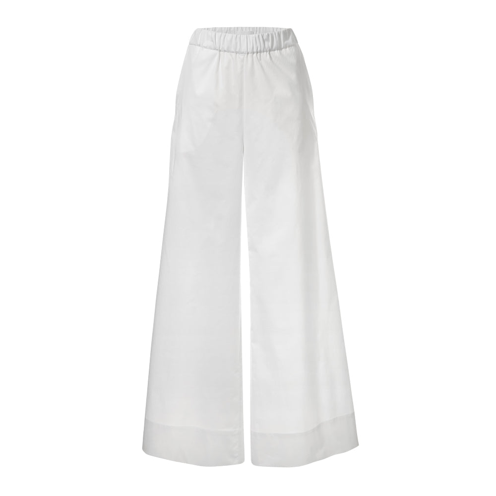 Discover the Zen Pants at The Luxe Maison, featuring a wide palazzo silhouette, elastic waistband, and side pockets for effortless comfort and versatile styling.