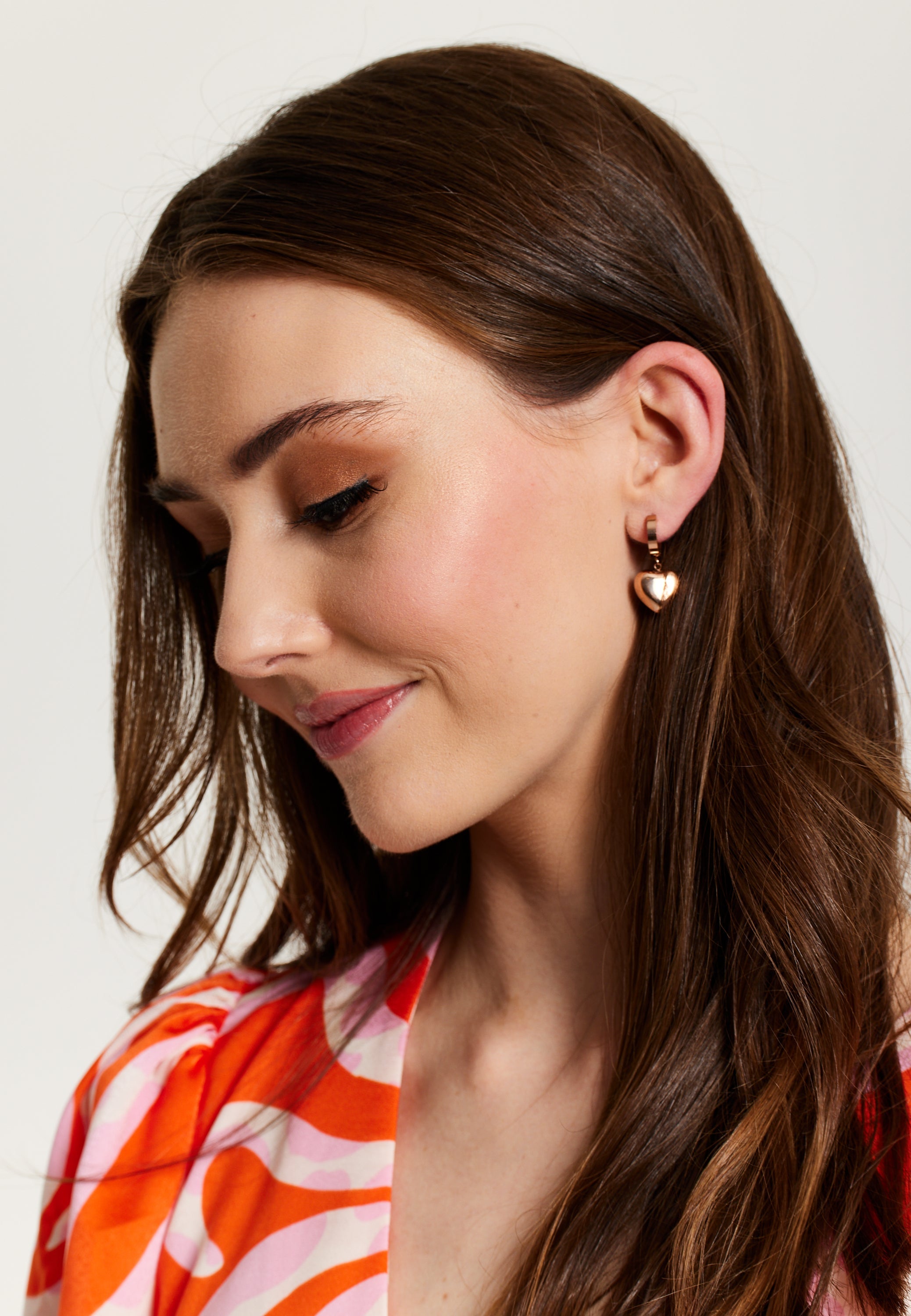 Liquorish Heart Earrings In Rose Gold