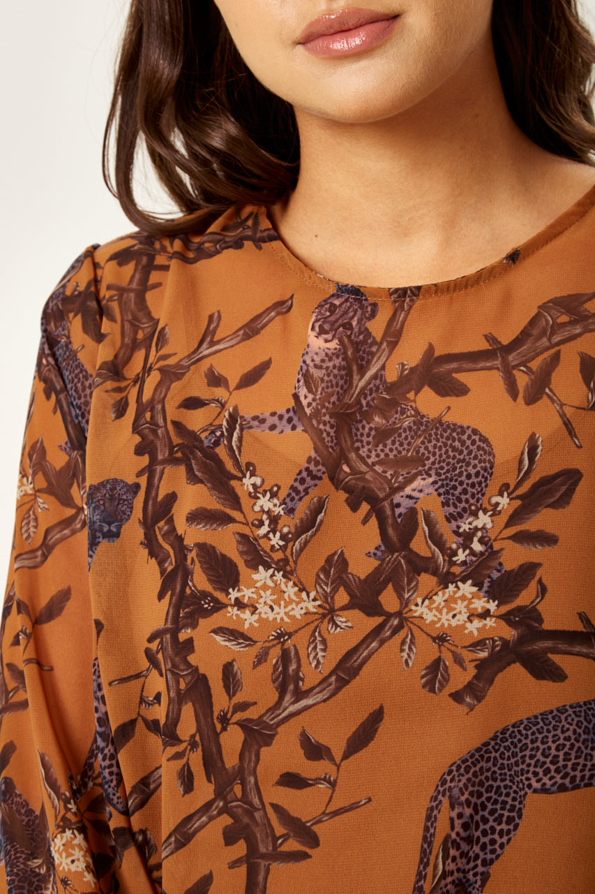 Enjoy online shopping with the stylish Women's Cheetah Print Long Sleeve Top in Grey. Shop Now!
